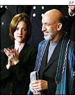 Shannon Spann, widow of a CIA agent killed in Afghanistan, and Hamid Karzai